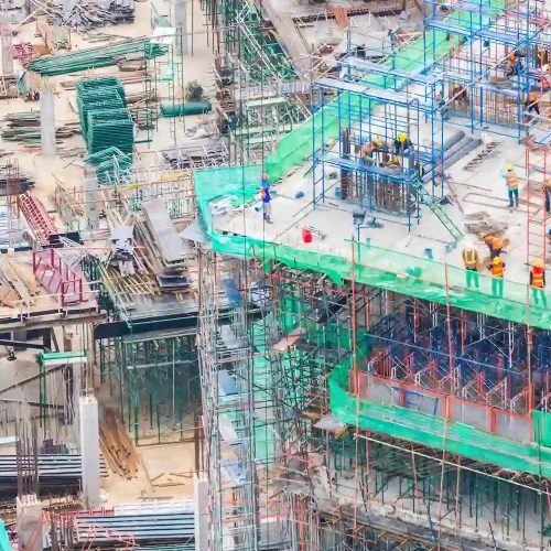 San Mateo Scaffolding Rental scaffolding system on busy construction site with workers and materials